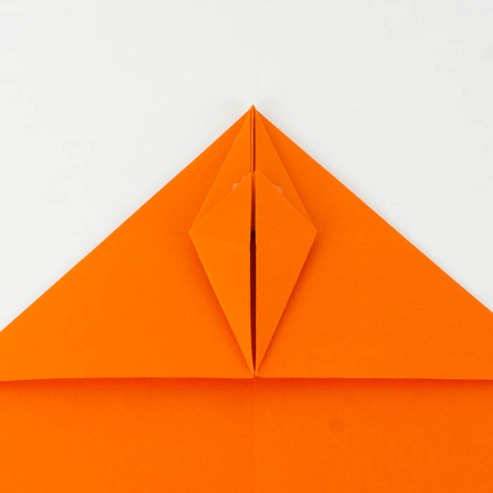 How to make a paper airplane - fold the tip